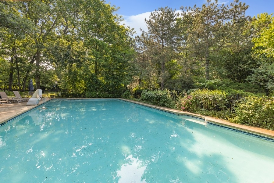 321 Oak Brook Road Oak Brook, IL 60523 - Photo 31 of 40 a view of a green yard with a large tree