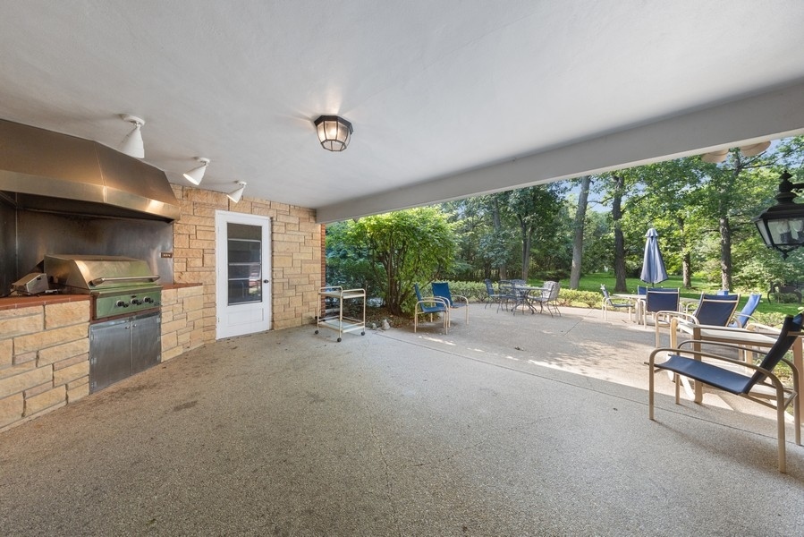 321 Oak Brook Road Oak Brook, IL 60523 - Photo 34 of 40 a view of a livingroom with furniture and a kitchen