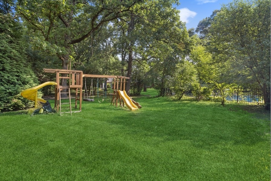 321 Oak Brook Road Oak Brook, IL 60523 - Photo 35 of 40 a view of a house with a backyard and a slide