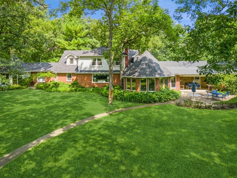 321 Oak Brook Road Oak Brook, IL 60523 - Photo 4 of 40 a front view of a house with a garden