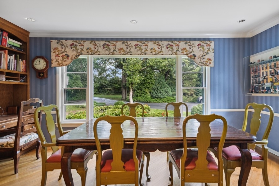 321 Oak Brook Road Oak Brook, IL 60523 - Photo 10 of 40 a view of a dining room with furniture window and outside view