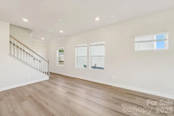 a view of an entryway with wooden floor