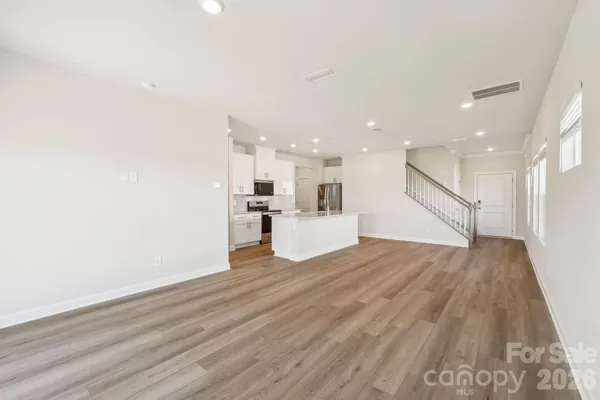 a view of kitchen with wooden floor
