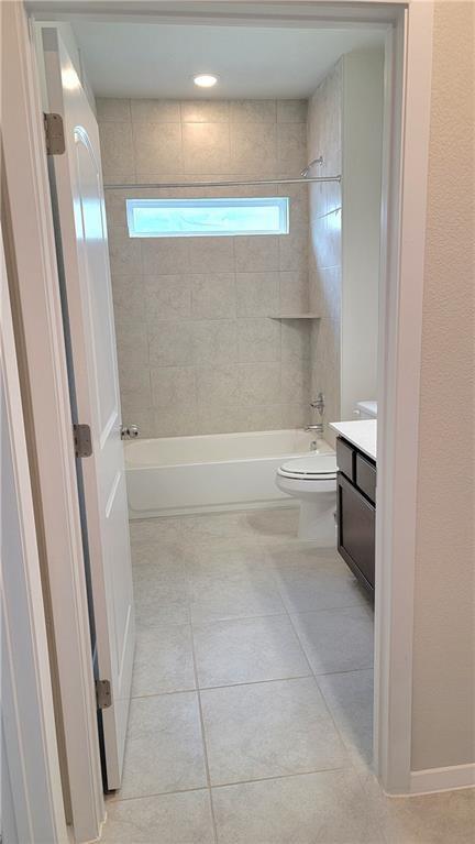 2741 Winding Creek Road Kyle, TX 78640 - Photo 4 of 11 Bathroom with vanity, bathing tub / shower combination, and light tile patterned floors