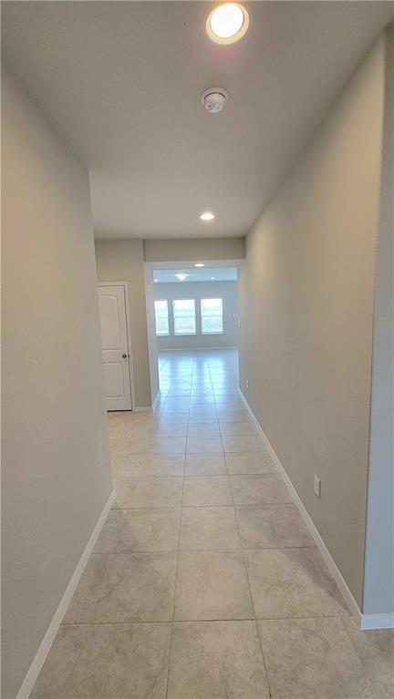 2741 Winding Creek Road Kyle, TX 78640 - Photo 5 of 11 Hall featuring recessed lighting and light tile patterned flooring