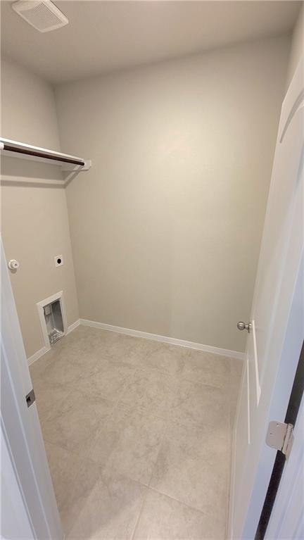 2741 Winding Creek Road Kyle, TX 78640 - Photo 8 of 11 Laundry room with baseboards and hookup for an electric dryer