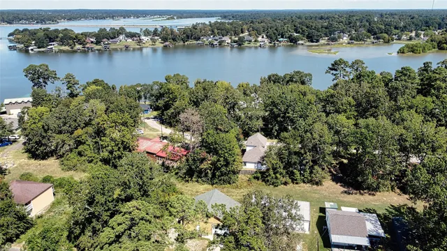 an aerial view of a houses with ocean view