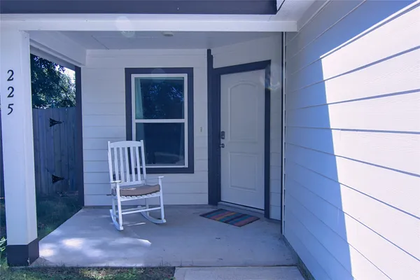 a chair and table in front of a window