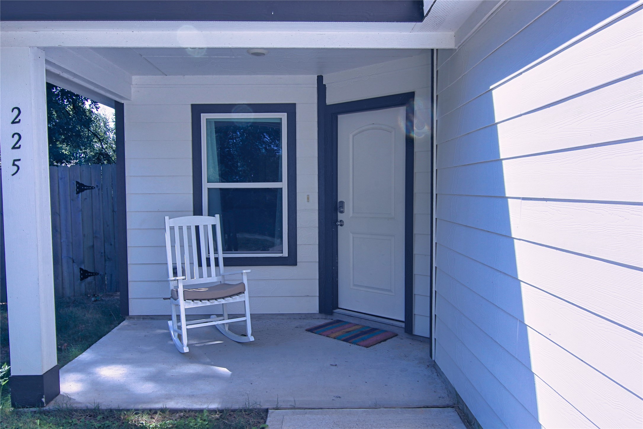 225 Basil Livingston, TX 77351 - Photo 2 of 22 a chair and table in front of a window