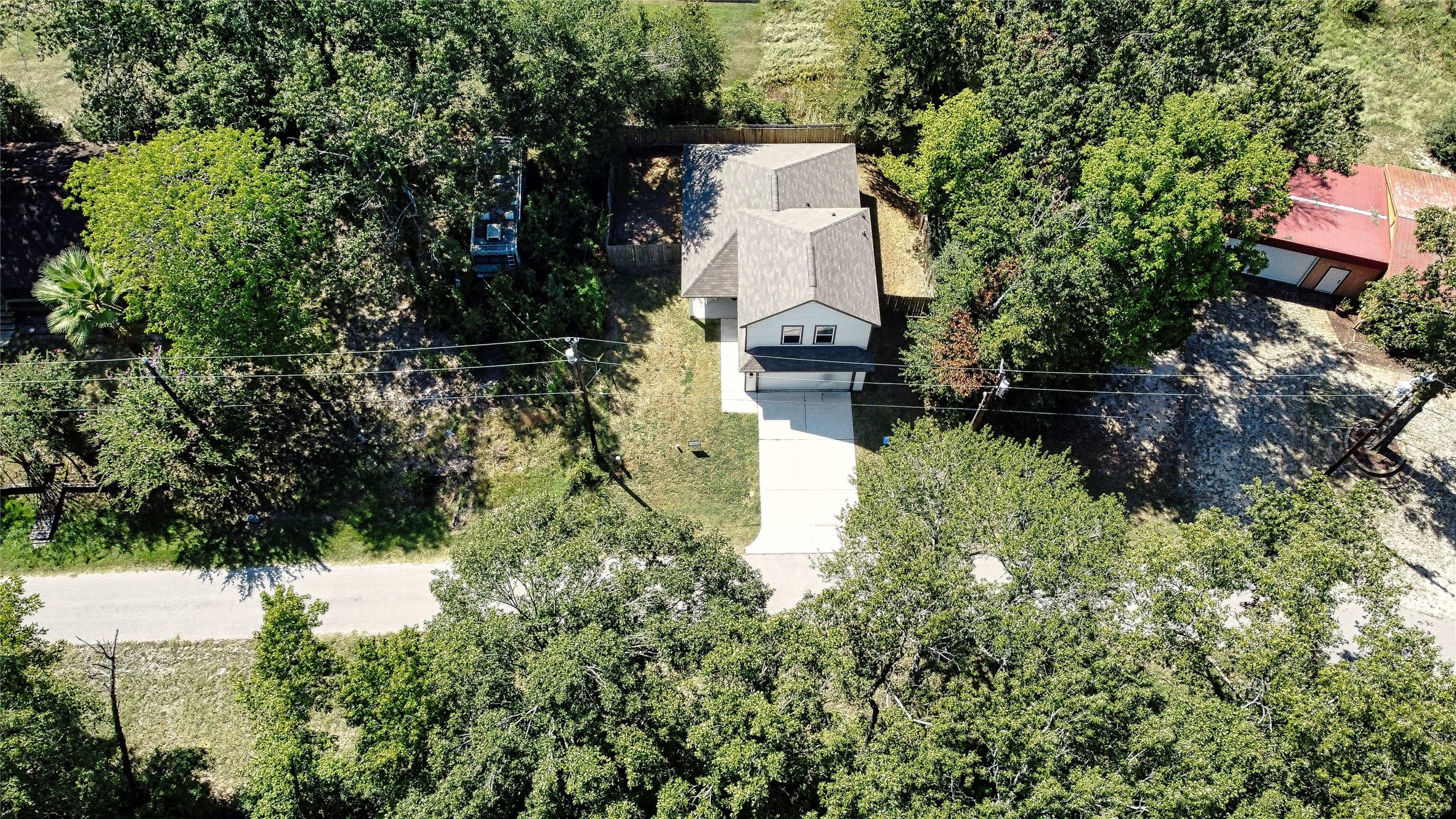 225 Basil Livingston, TX 77351 - Photo 22 of 22 an aerial view of a house with a yard and lake view