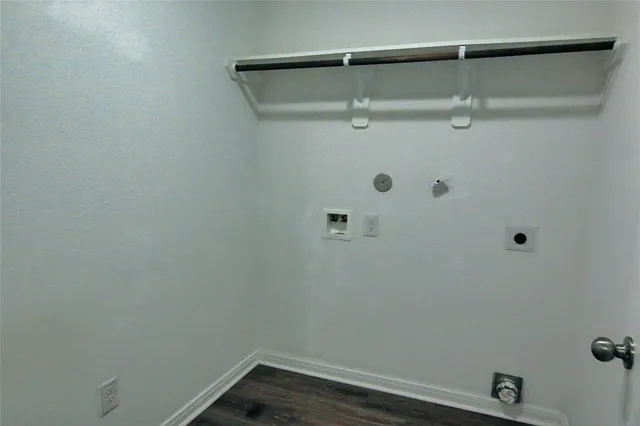 a kitchen with stainless steel appliances wooden cabinets and granite counter tops