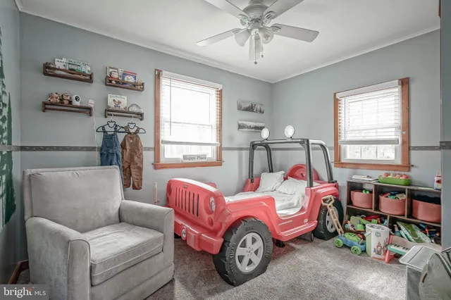 a bedroom with furniture and a chandelier