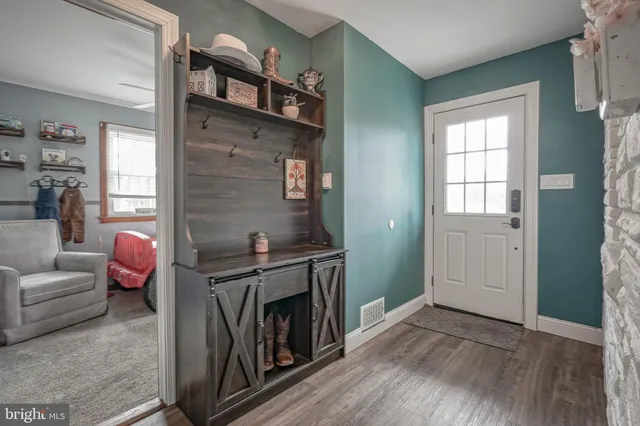 a kitchen with a stove and a refrigerator