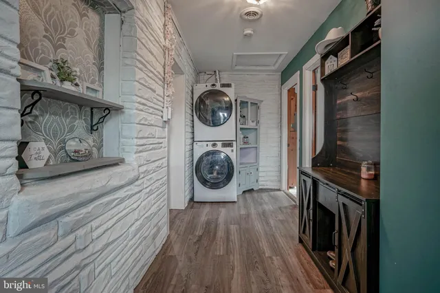 a view of a storage & utility room with wooden floor