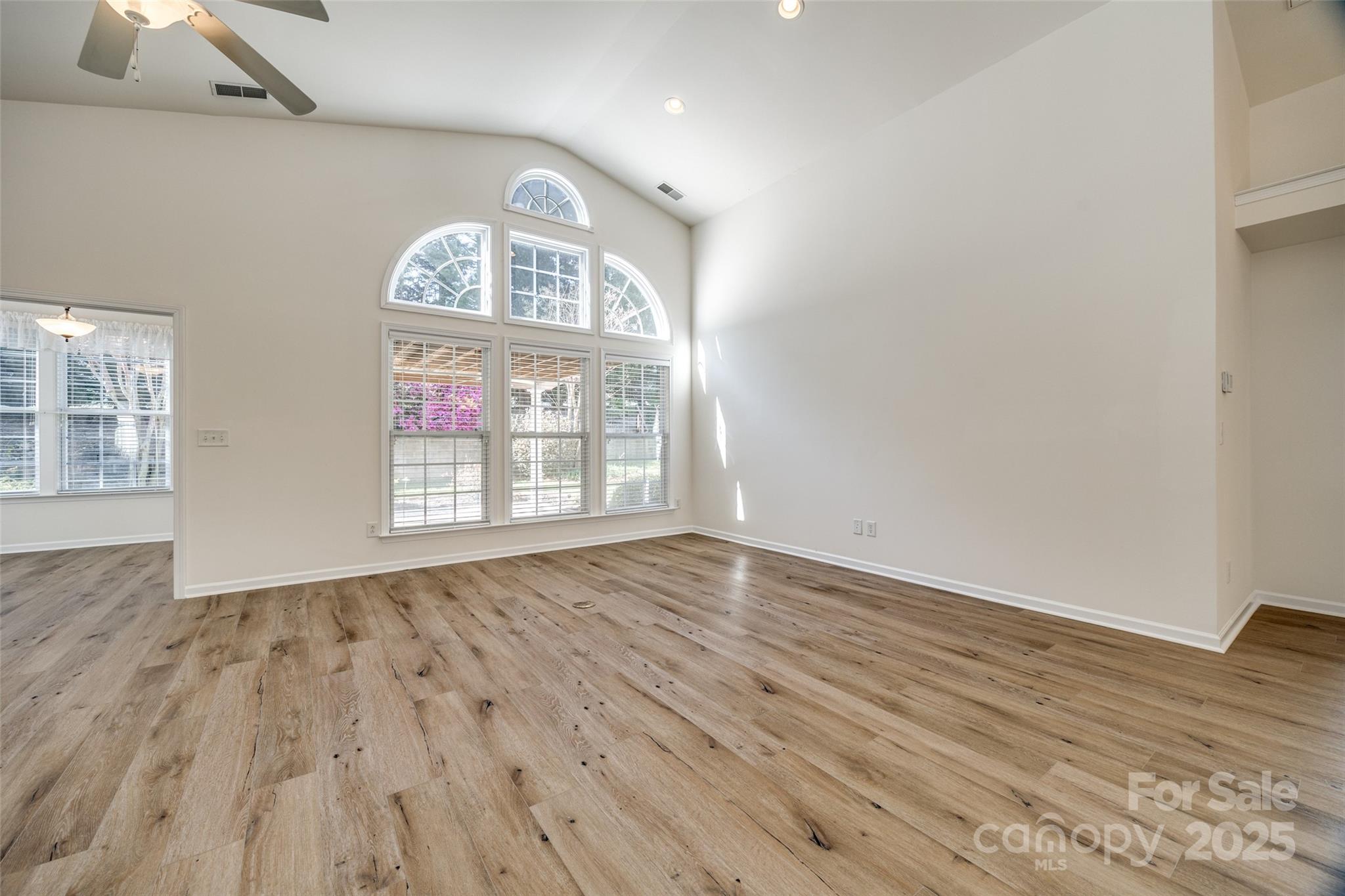 974 Platinum Drive Fort Mill, SC 29708 - Photo 14 of 48 an empty room with wooden floor fan and windows