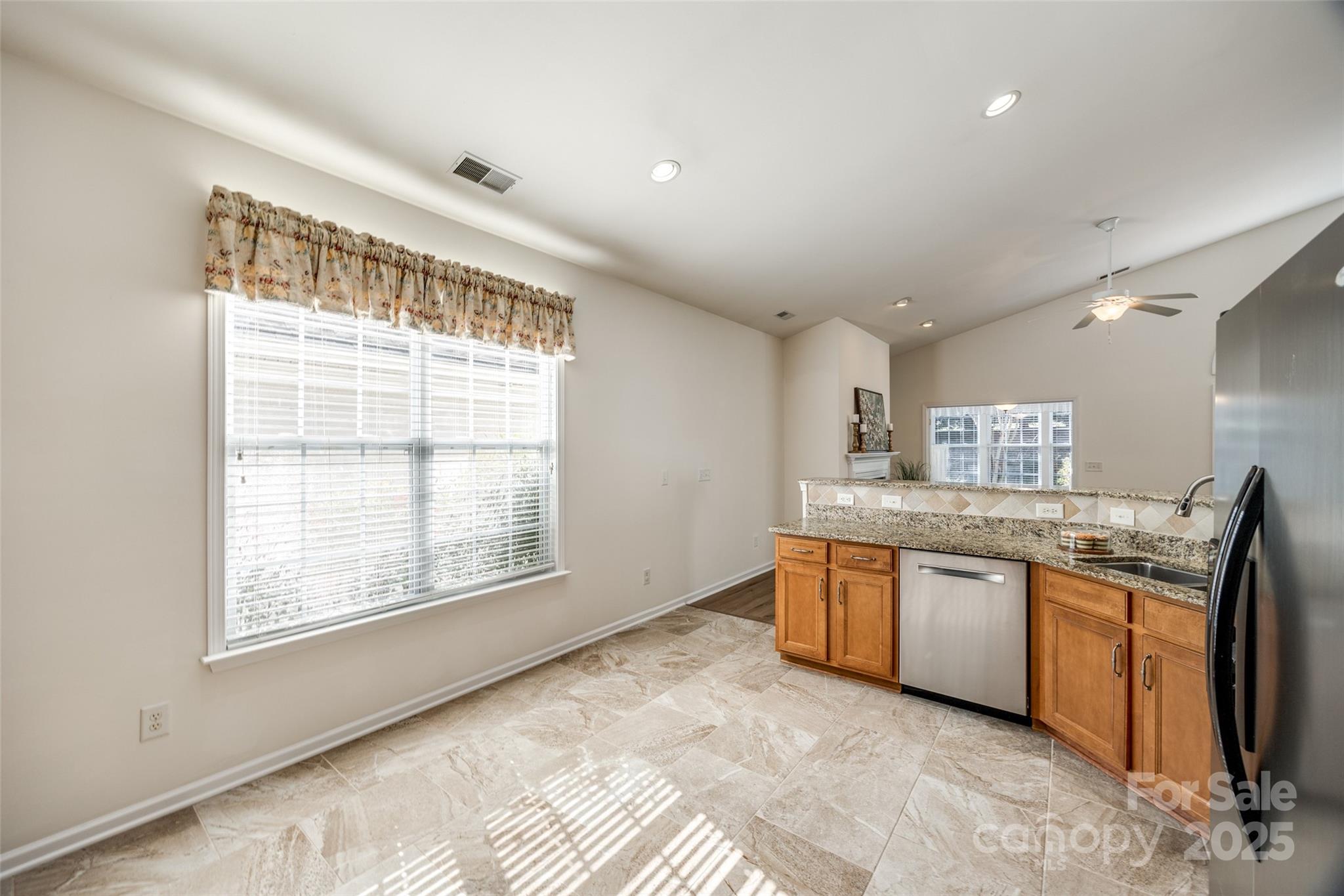 974 Platinum Drive Fort Mill, SC 29708 - Photo 20 of 48 a large kitchen with stainless steel appliances granite countertop a sink and a stove