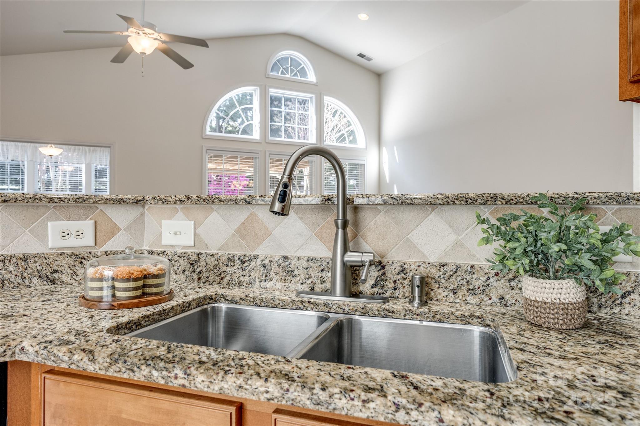 974 Platinum Drive Fort Mill, SC 29708 - Photo 21 of 48 a kitchen with a sink a stove and a wooden floor