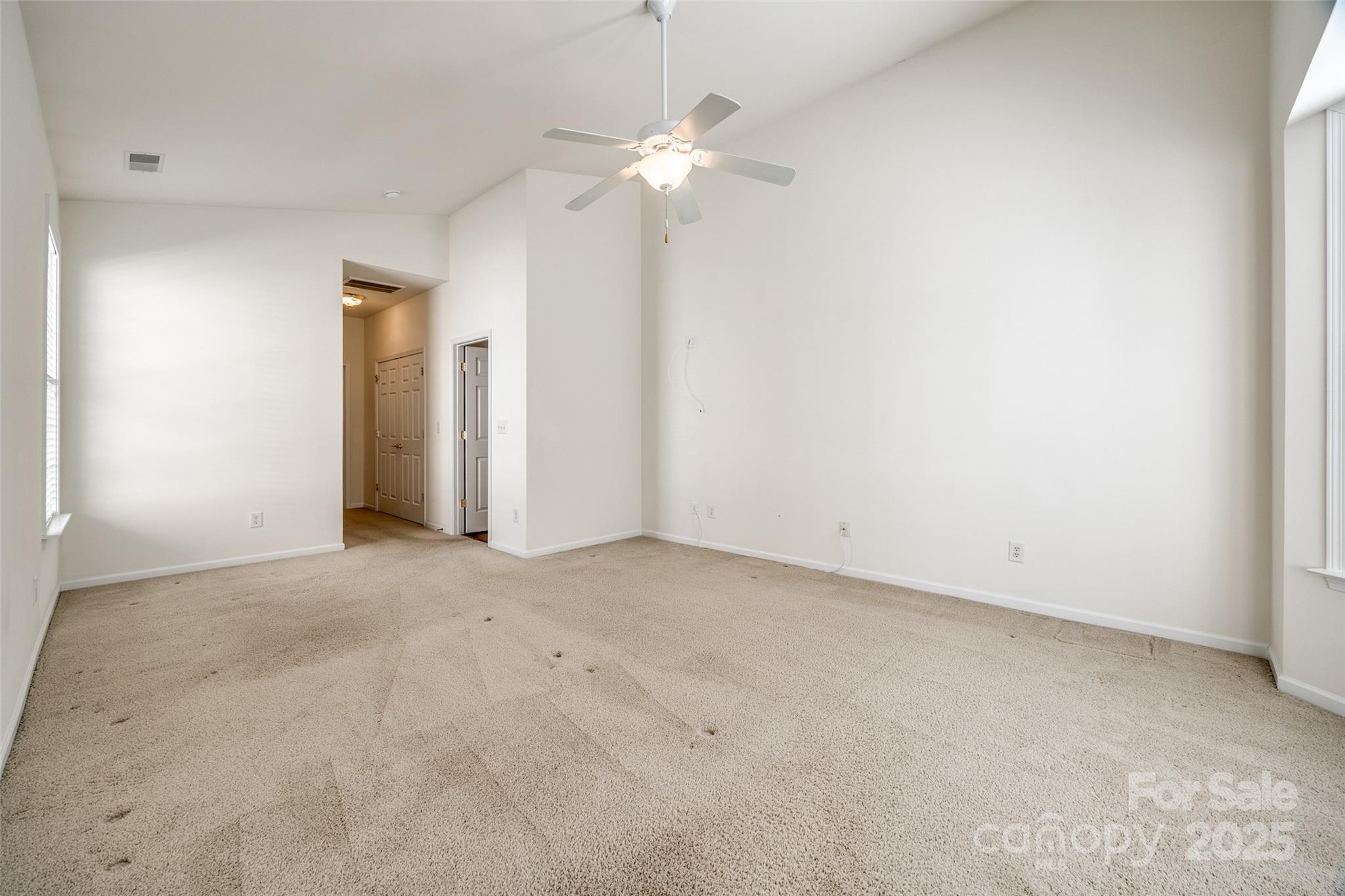 974 Platinum Drive Fort Mill, SC 29708 - Photo 24 of 48 an empty room with a chandelier fan and a window