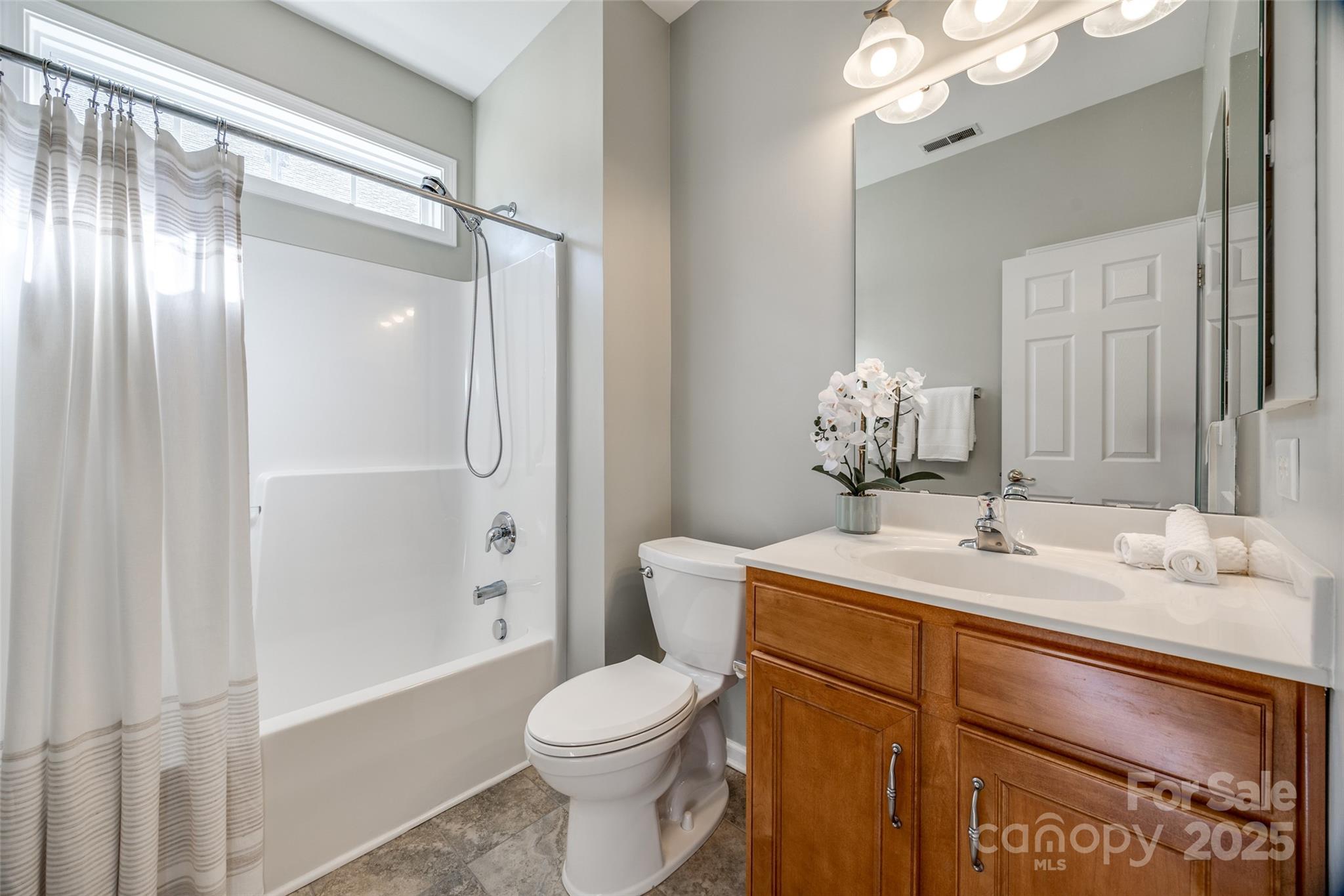 974 Platinum Drive Fort Mill, SC 29708 - Photo 29 of 48 a bathroom with a sink vanity granite toilet and shower