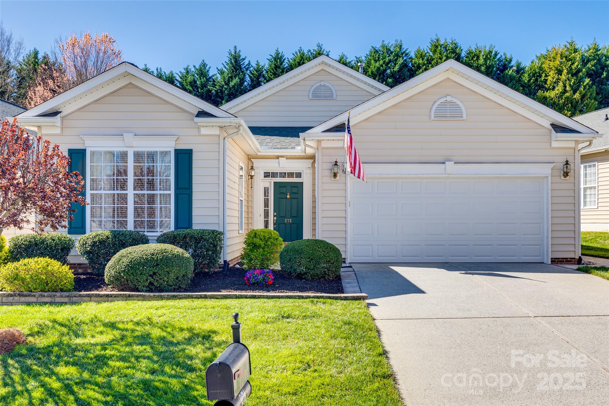 974 Platinum Drive Fort Mill, SC 29708 - Photo 3 of 48 a front view of a house with garden