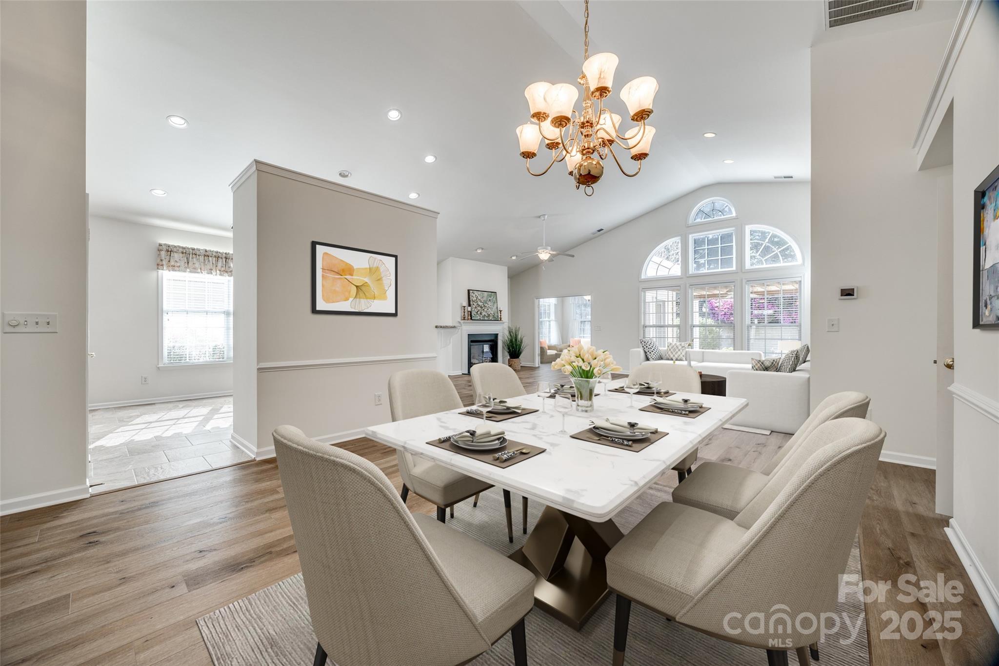 974 Platinum Drive Fort Mill, SC 29708 - Photo 9 of 48 a view of a dining room with furniture wooden floor and chandelier
