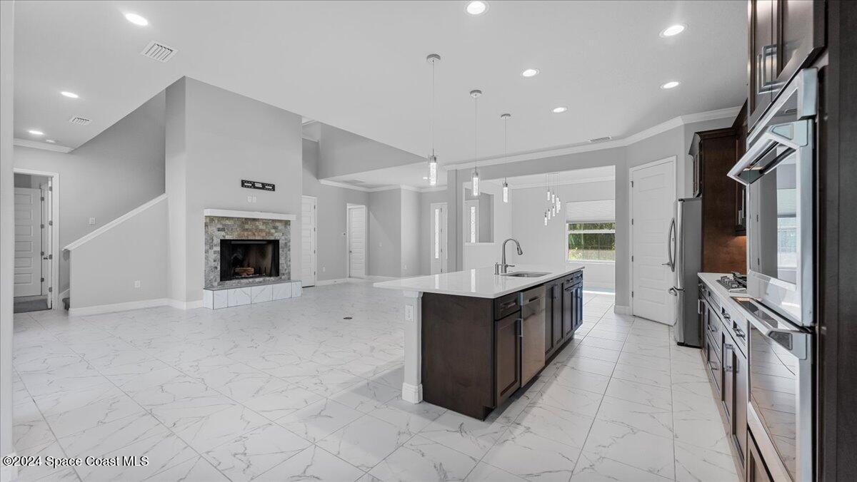 1016 Gray Road Cocoa, FL 32926 - Photo 19 of 59 17-Kitchen to Living