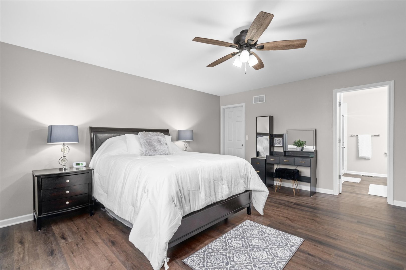 278 Windett Ridge Road Yorkville, IL 60560 - Photo 18 of 31 a bed room with a bed and a chandelier