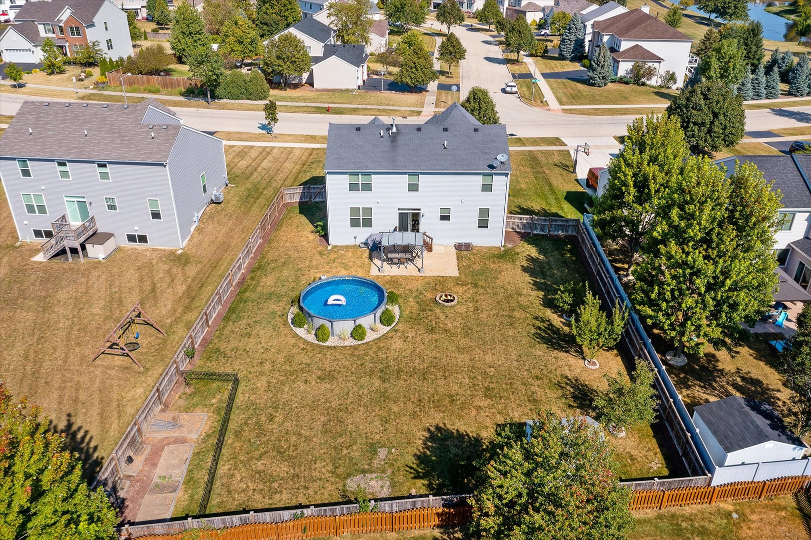 278 Windett Ridge Road Yorkville, IL 60560 - Photo 29 of 31 an aerial view of a house with a swimming pool