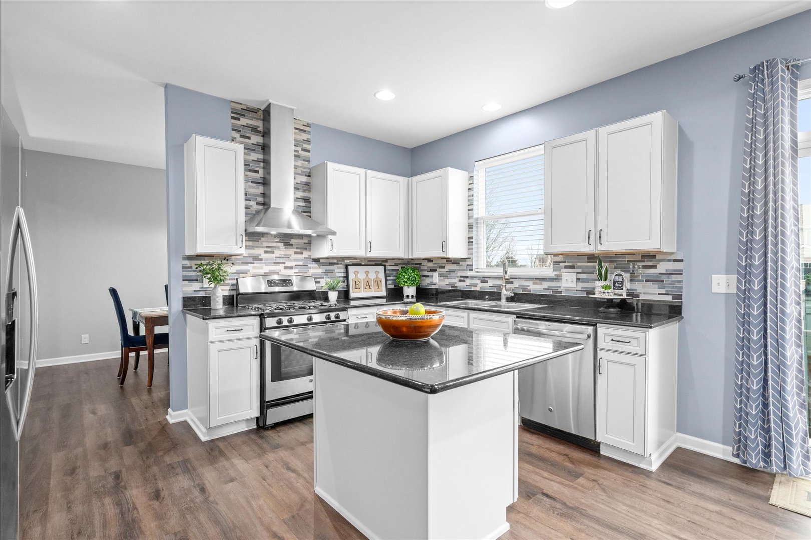 278 Windett Ridge Road Yorkville, IL 60560 - Photo 8 of 31 a kitchen with a white cabinets and chairs