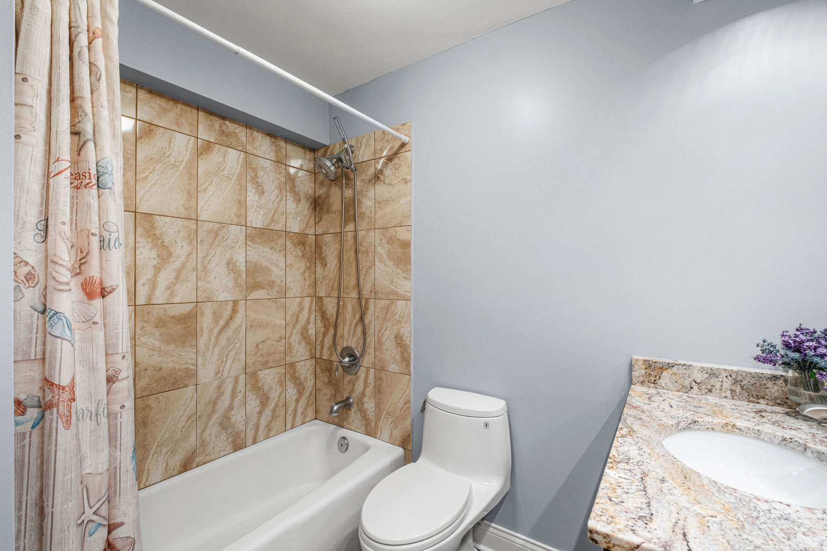 5455 North Sheridan Road, Unit 711 Chicago, IL 60640 - Photo 12 of 25 a white toilet sitting next to a bath tub