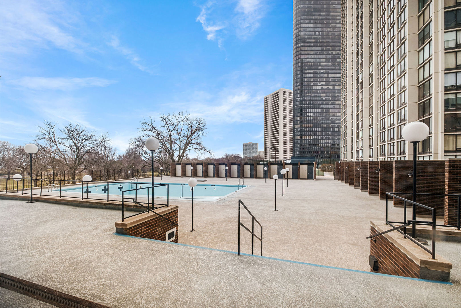 5455 North Sheridan Road, Unit 711 Chicago, IL 60640 - Photo 13 of 25 a view of swimming pool with outdoor seating and city view