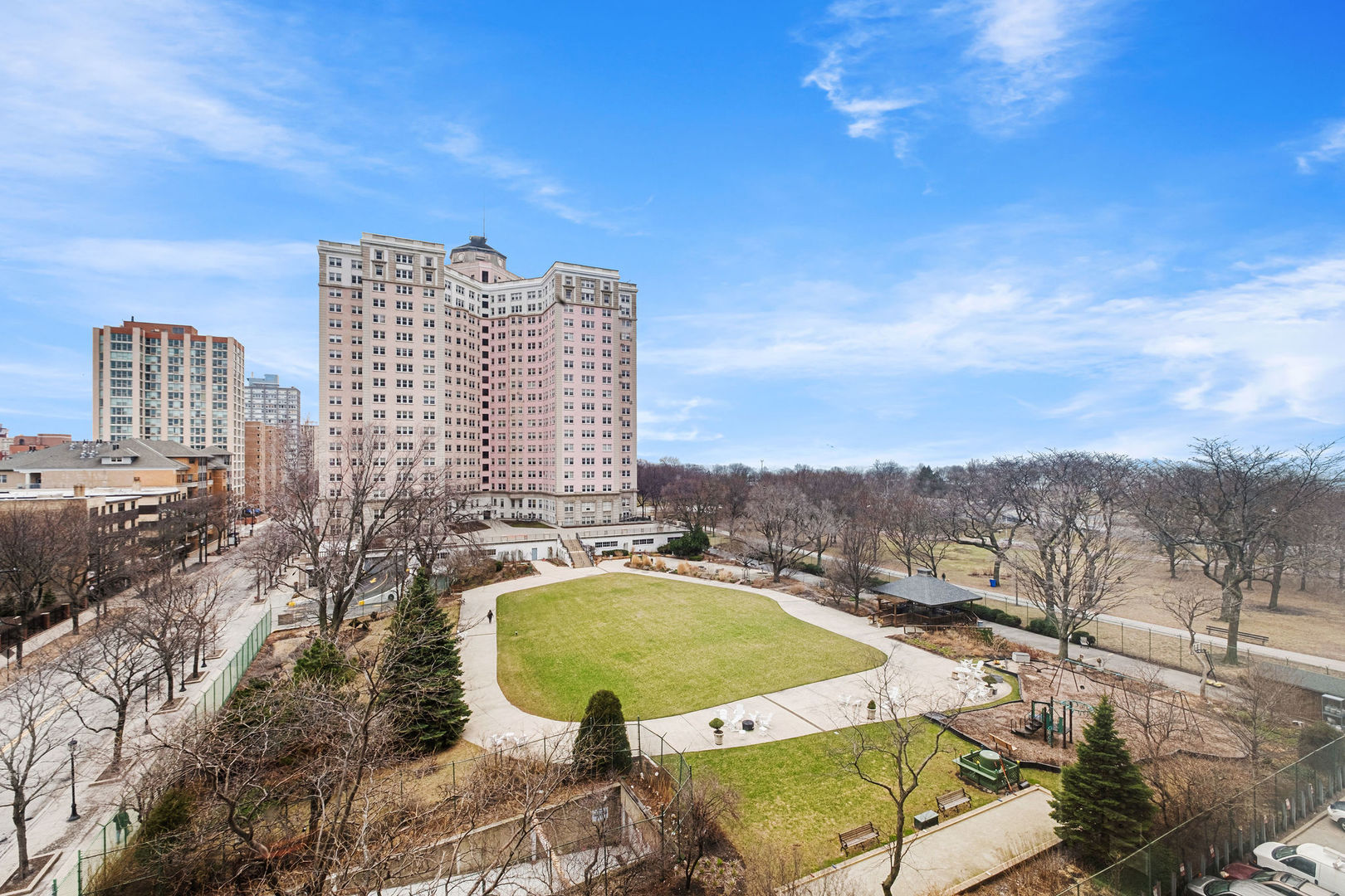 5455 North Sheridan Road, Unit 711 Chicago, IL 60640 - Photo 15 of 25 a view of a balcony with a table and chairs