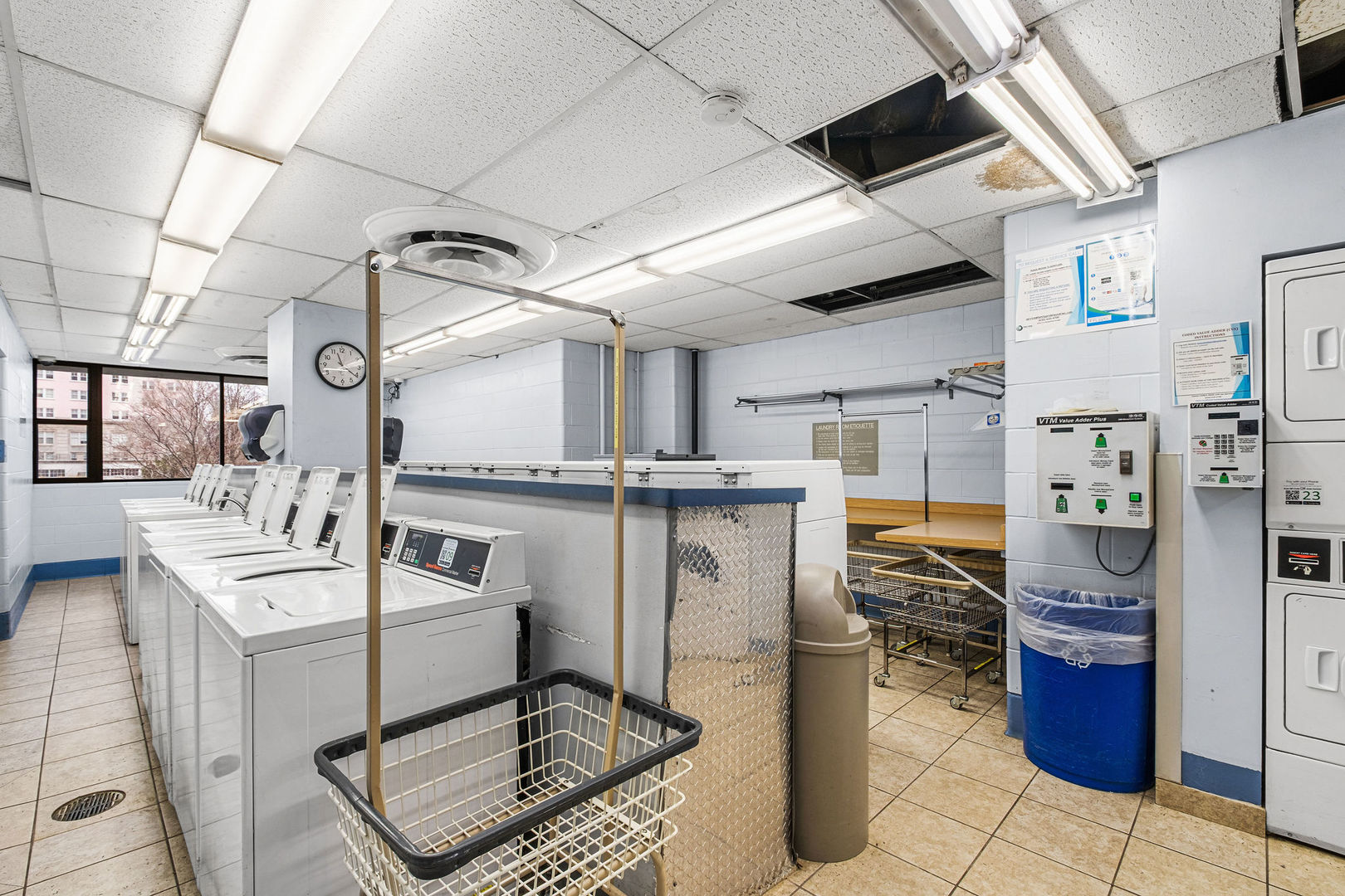 5455 North Sheridan Road, Unit 711 Chicago, IL 60640 - Photo 18 of 25 a kitchen with a sink appliances and cabinets