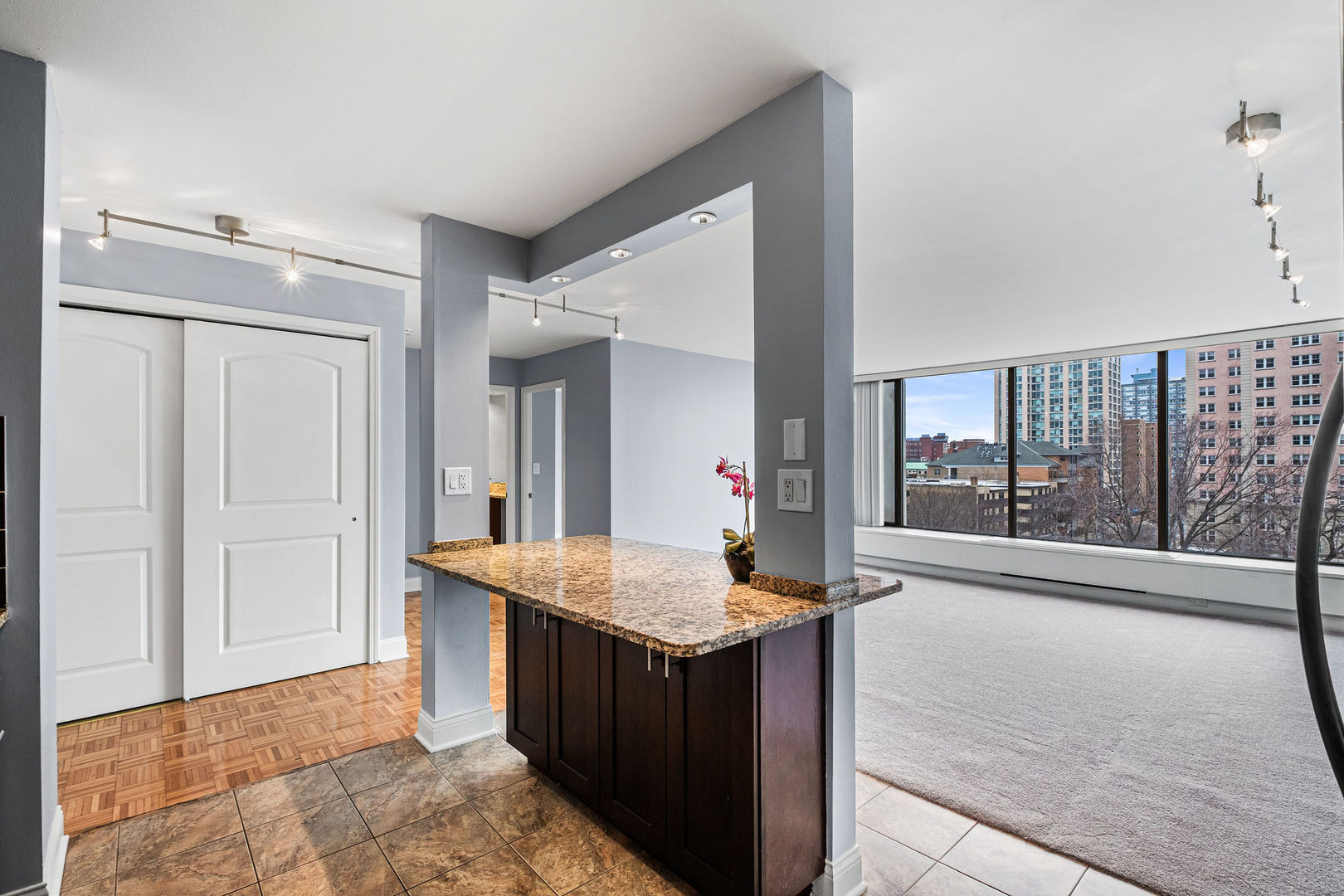 5455 North Sheridan Road, Unit 711 Chicago, IL 60640 - Photo 8 of 25 a view of kitchen with granite countertop cabinets and sink