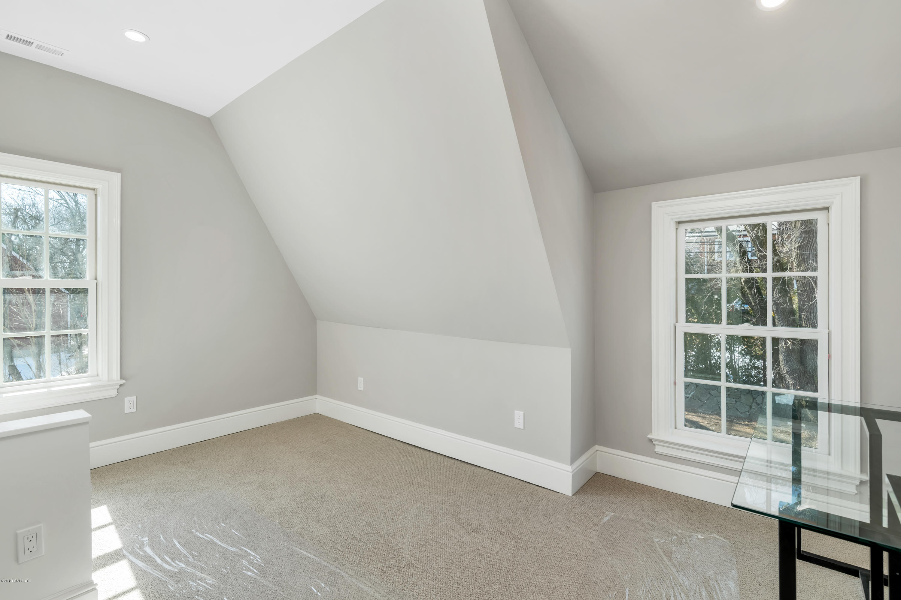 350 Riverside Avenue, Unit B Riverside, CT 06878 - Photo 11 of 15 an empty room with a window