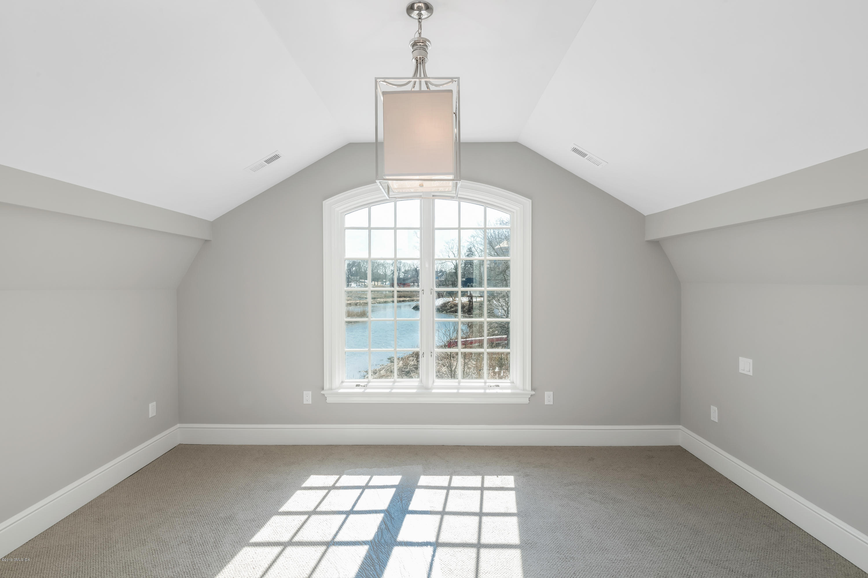 350 Riverside Avenue, Unit B Riverside, CT 06878 - Photo 12 of 15 wooden floor in an empty room with a window