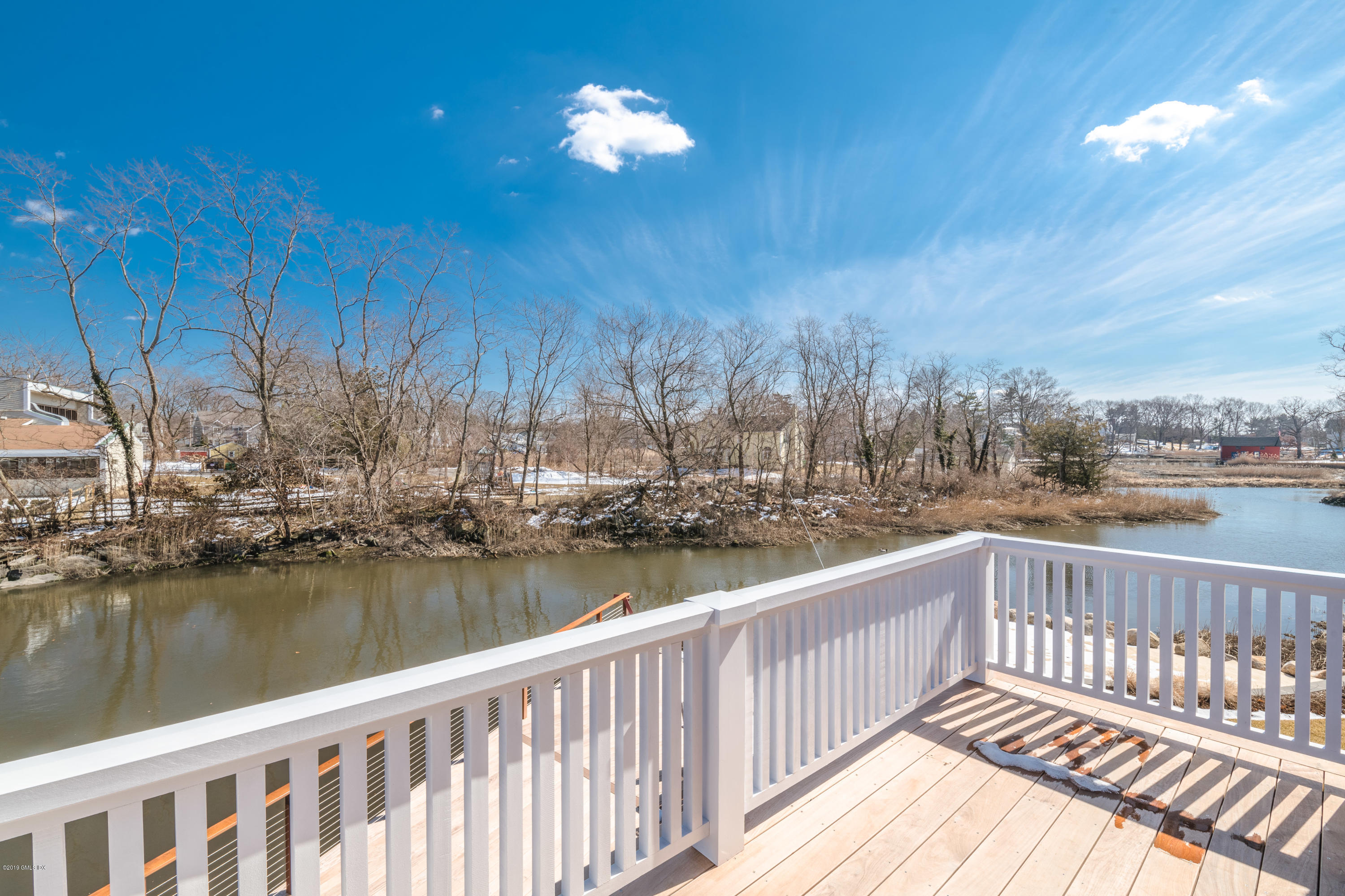 350 Riverside Avenue, Unit B Riverside, CT 06878 - Photo 15 of 15 a view of a balcony with wooden fence