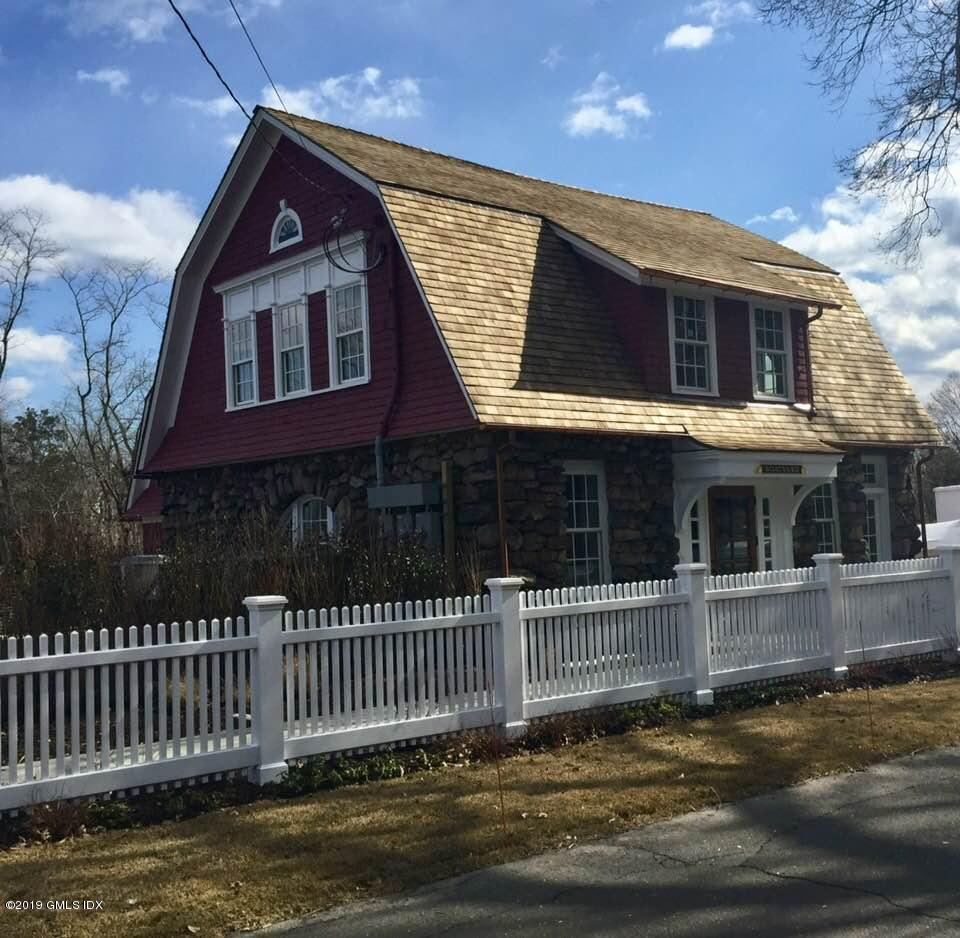 350 Riverside Avenue, Unit B Riverside, CT 06878 - Photo 4 of 15 a front view of a house with a garden