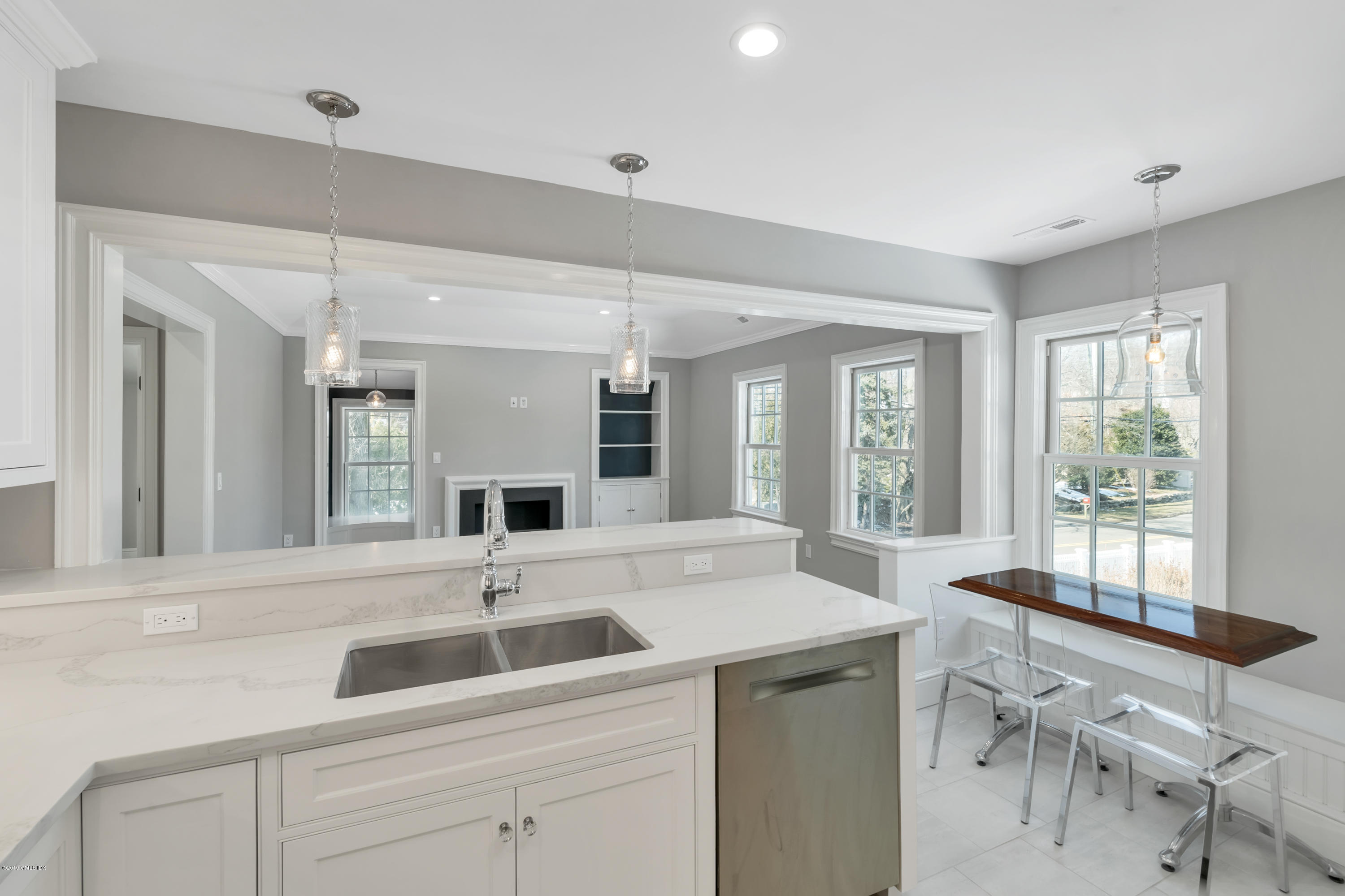 350 Riverside Avenue, Unit B Riverside, CT 06878 - Photo 8 of 15 a open kitchen with a sink and chairs