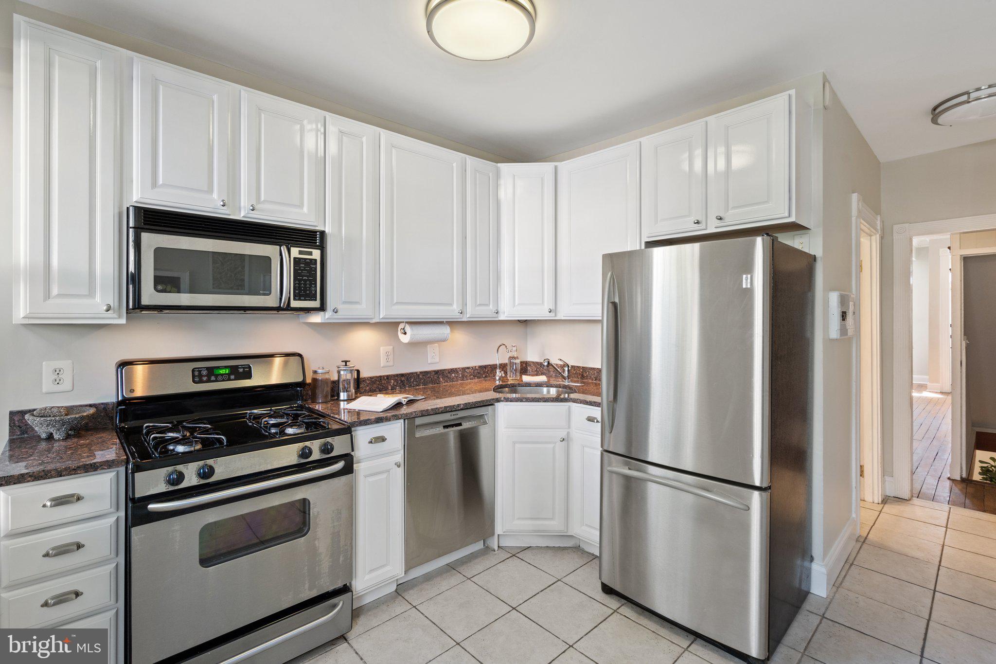 1619 Marion Street Northwest Washington, DC 20001 - Photo 15 of 41 Rear kitchen, crisp cabinets, stainless appliances