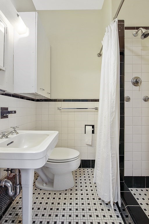 21 Beacon Street, Unit 7L Boston, MA 02108 - Photo 14 of 18 a bathroom with a sink toilet and shower