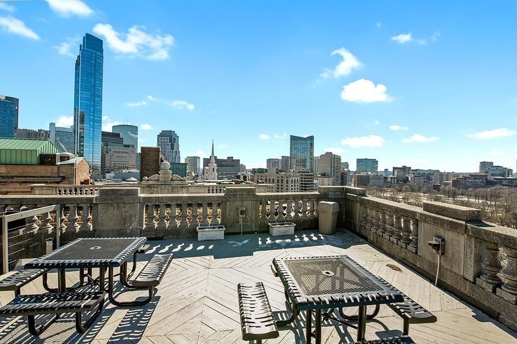21 Beacon Street, Unit 7L Boston, MA 02108 - Photo 16 of 18 a balcony with furniture and city view