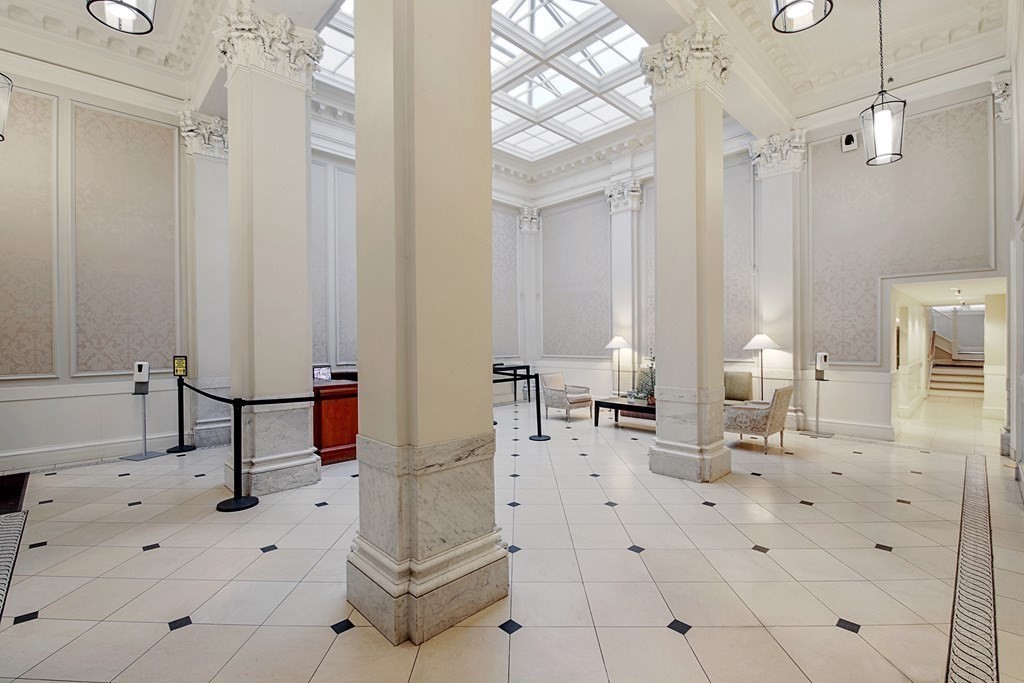 21 Beacon Street, Unit 7L Boston, MA 02108 - Photo 2 of 18 a bathroom with a sink mirror and a shower