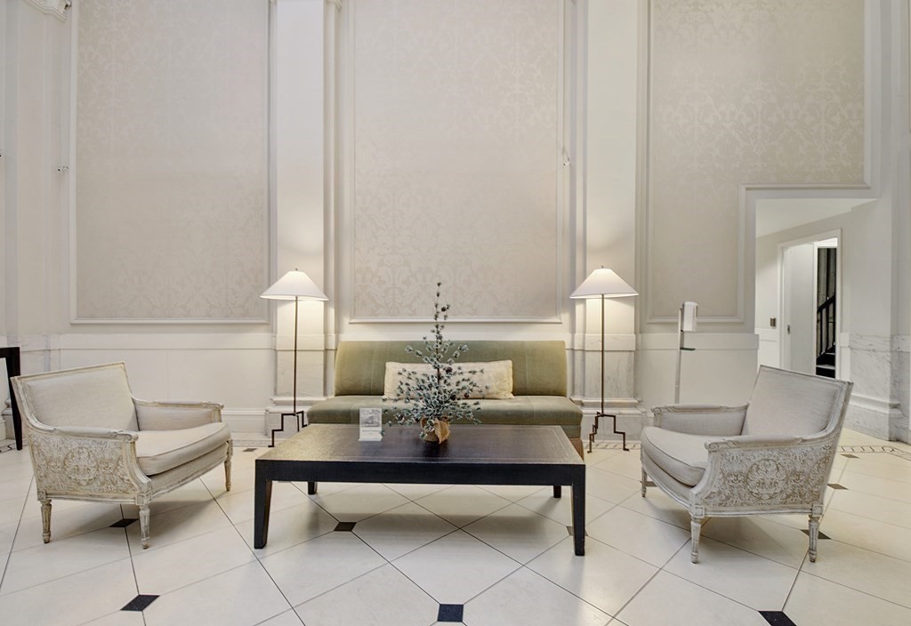 21 Beacon Street, Unit 7L Boston, MA 02108 - Photo 4 of 18 a living room with furniture and wooden floor