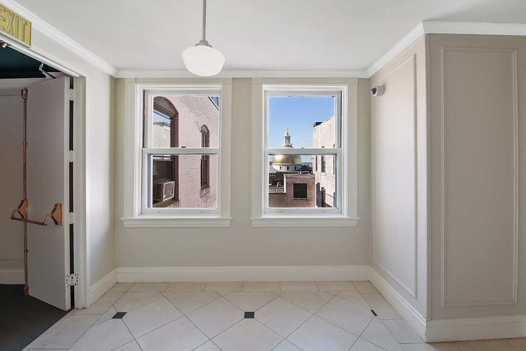 21 Beacon Street, Unit 7L Boston, MA 02108 - Photo 8 of 18 a view of an empty room with a window