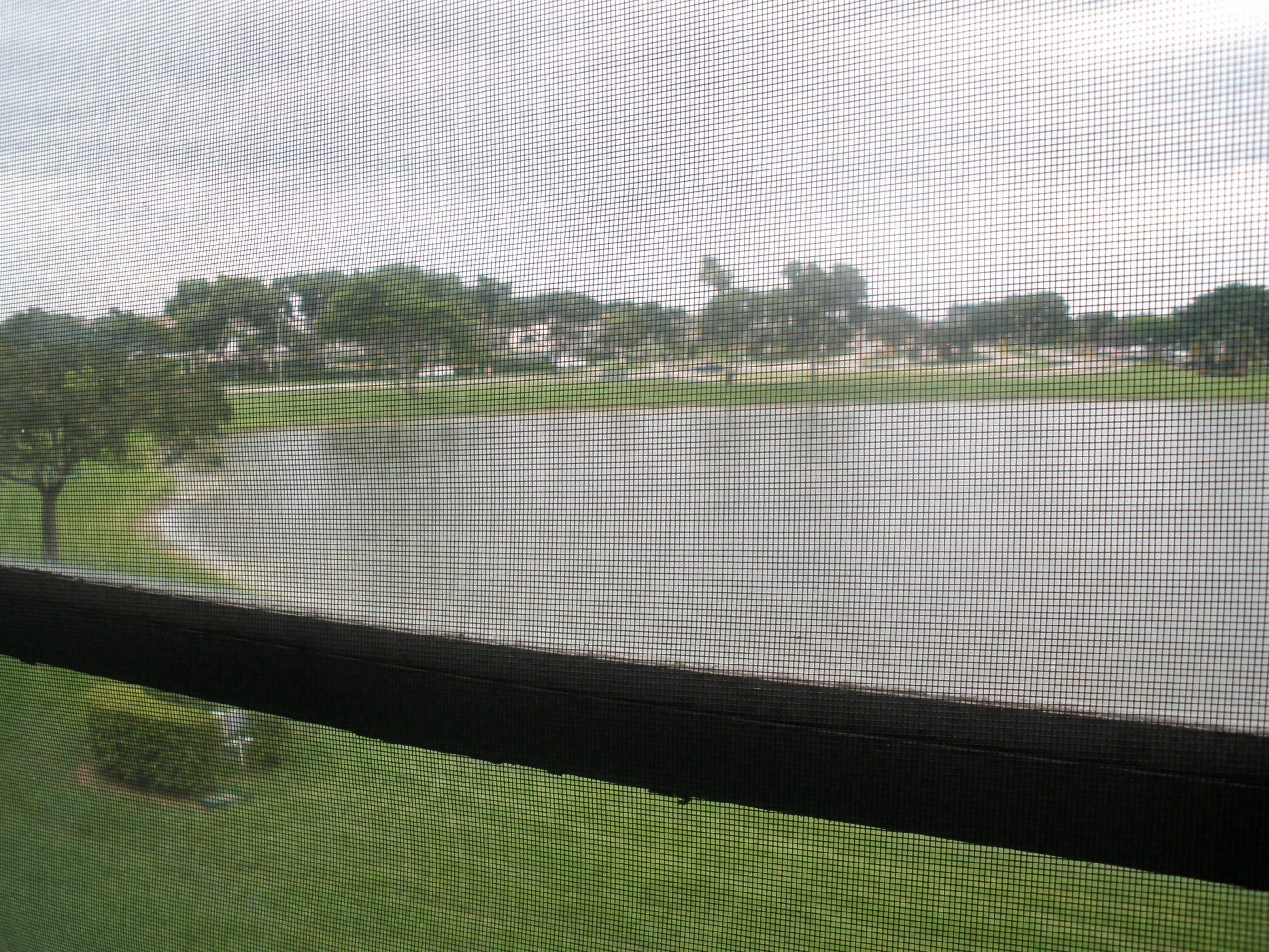 3091 Cornwall East, Unit E Boca Raton, FL 33434 - Photo 11 of 12 a view of a lake from a yard