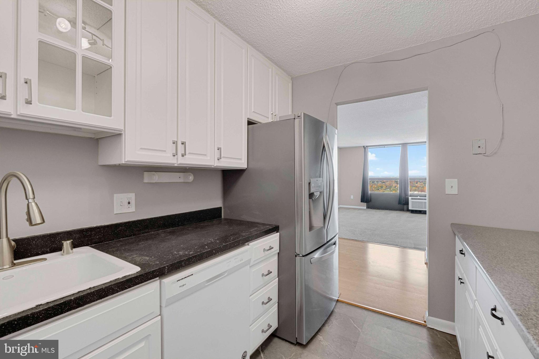 205 East Joppa Road, Unit 1902 Towson, MD 21286 - Photo 16 of 27 a kitchen with stainless steel appliances granite countertop a refrigerator and a stove