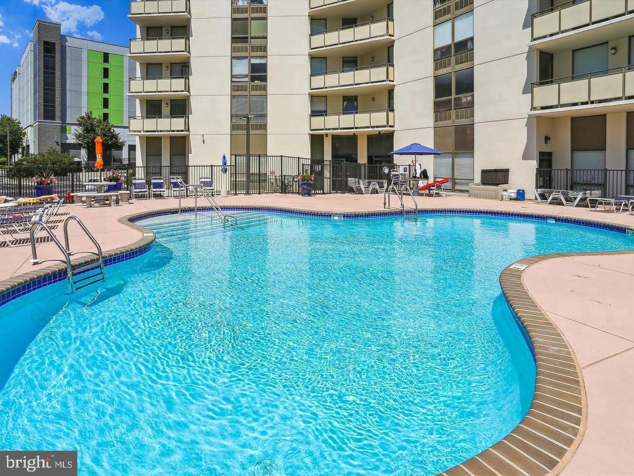 205 East Joppa Road, Unit 1902 Towson, MD 21286 - Photo 27 of 27 a swimming pool with outdoor seating and yard