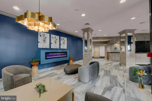 a kitchen with stainless steel appliances granite countertop a sink a stove and a wooden floors