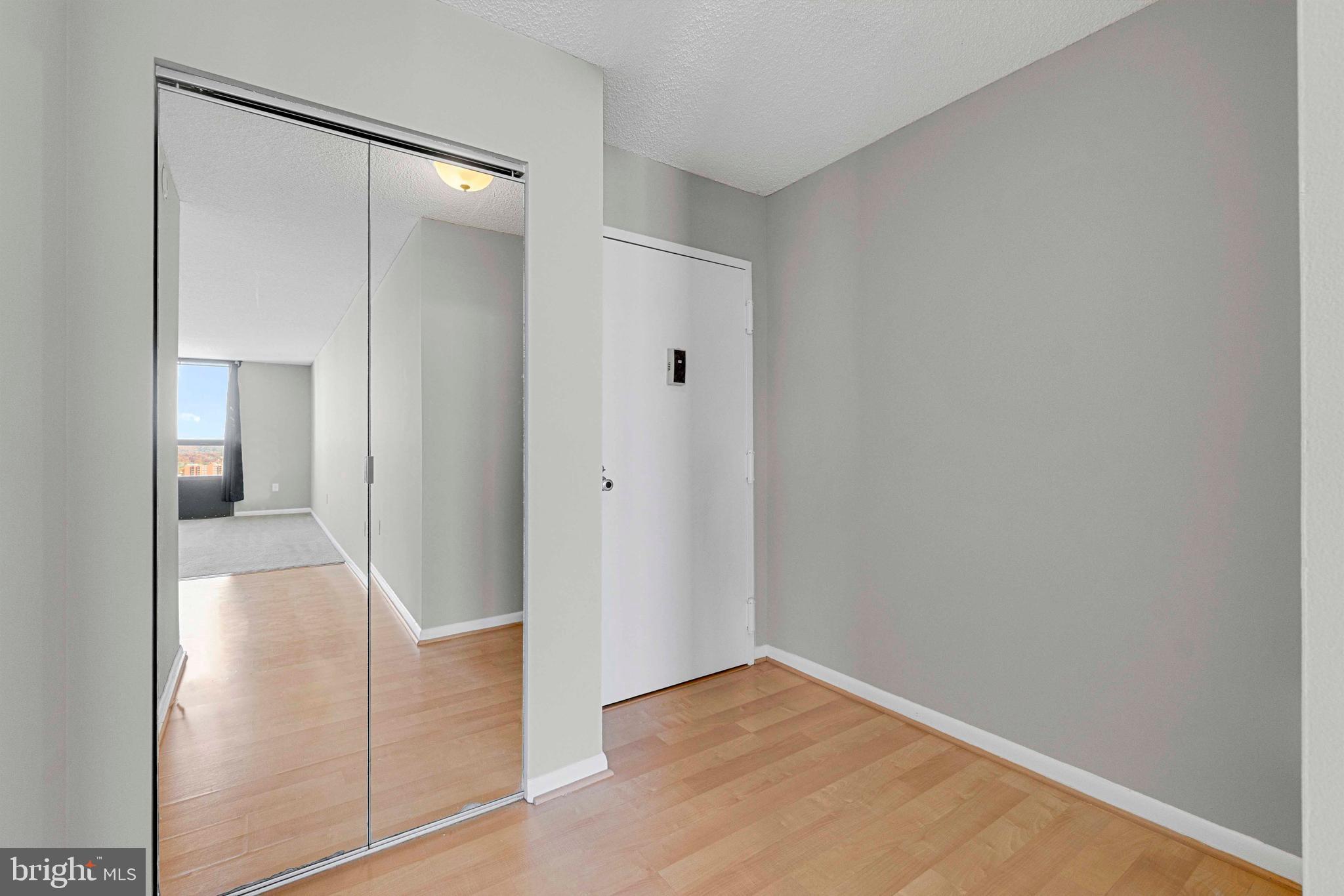 205 East Joppa Road, Unit 1902 Towson, MD 21286 - Photo 6 of 27 a view of a hallway with wooden floor
